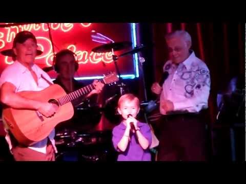 7 year old boy singing on stage with George Jones - Louisiana Saturday Night and White Lightning