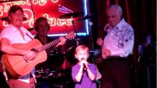 7 year old boy singing on stage with George Jones - Louisiana Saturday Night and White Lightning chords