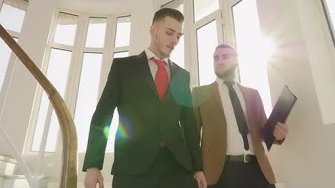 Businessmen Going Down Office Stairs  Stock Footage