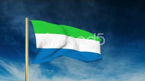 Sierra Leone Flag Slider Style. Waving In The Wind With Cloud Background
