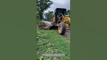 Shaping the Edge: Road Grader Cuts Perfect Drainage Ditch