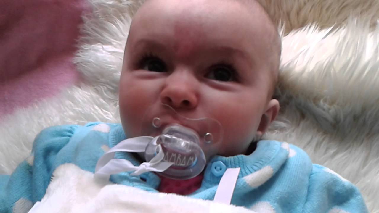 baby chewing on dummy