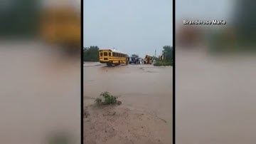 Students and adults rescued from school bus stuck on flooded road in Arizona