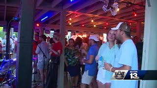 Auburn fans pack Birmingham's Lakeview area to watch the Tigers fall to the Gators in the Final Four