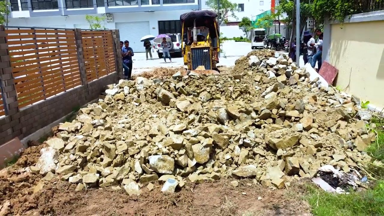 KOMATSU Bulldozer Pushing The Rocks Filling up the areas