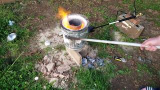 Melting Soda Cans In A Backyard Foundry