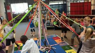 First learning how to weave May Pole