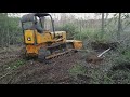 John deere 450c clearing brush