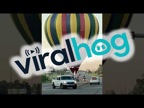 Hot Air Balloon Stops Traffic With Unscheduled Landing || ViralHog