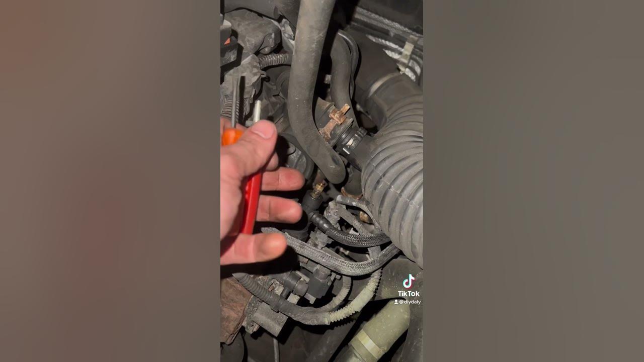 How to bleed the fuel system after replacing the fuel filter on a ford