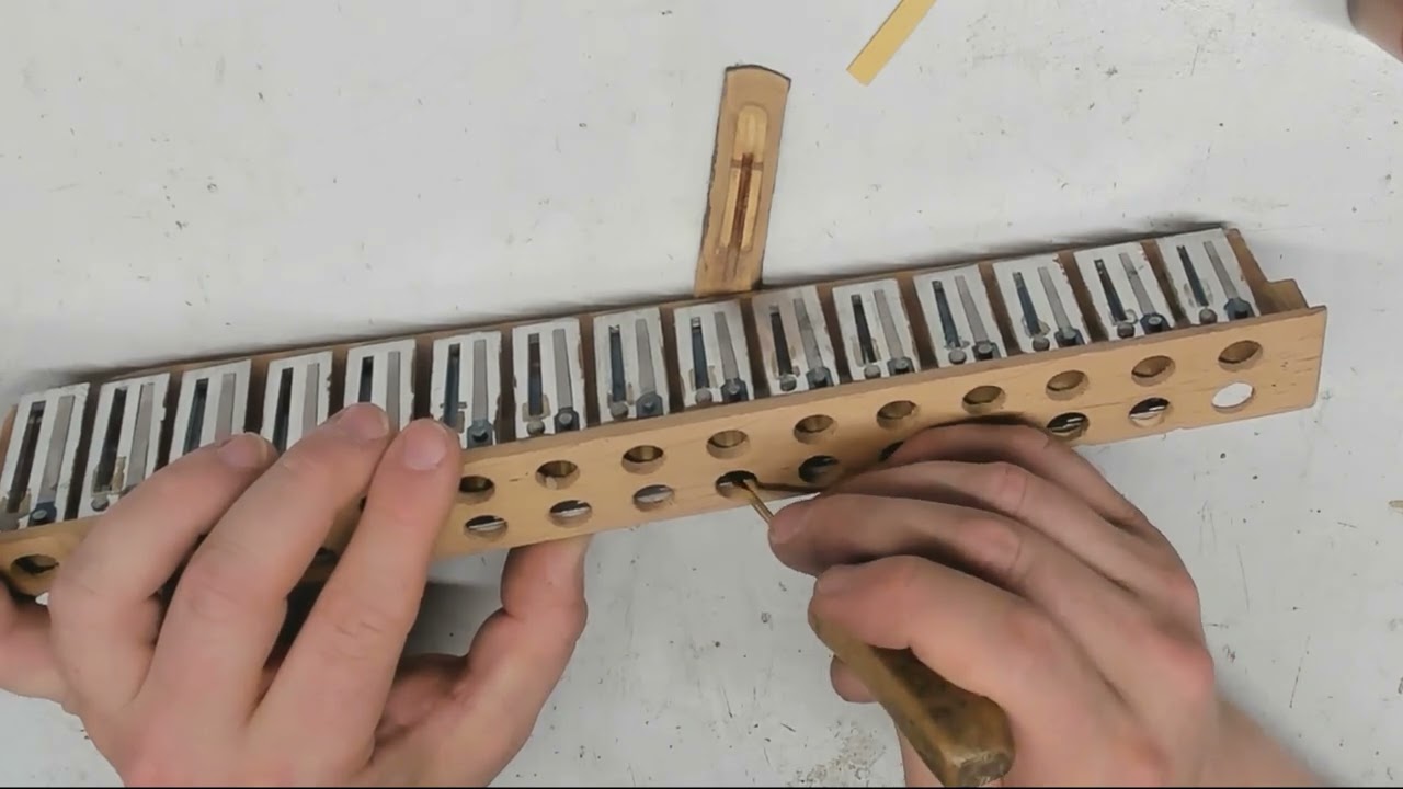 Harmonikan venttiilien liimaus