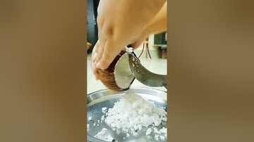 Manual Coconut Scrapping/Grating.