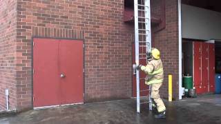Ladder training involving single firefighter 24' extension ladder raises