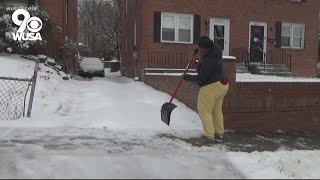 DC residents work together to clear snow from side roads