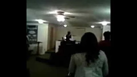 Pastor Kenneth Teasley singing before preaching.