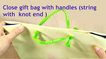 closing a gift bag with its own string/ close gift bag with handles (string with  knot end )