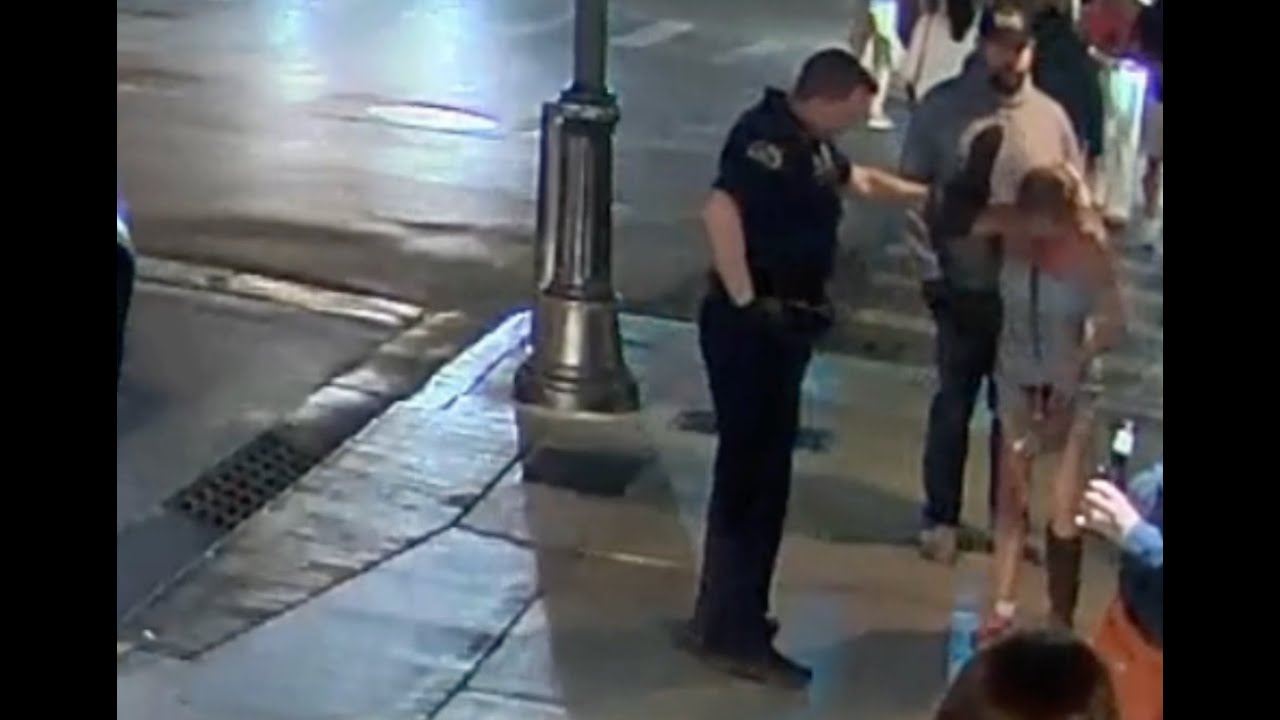 extremely-intoxicated-woman-on-sidewalk-outside-sloppy-joe-s-escorted