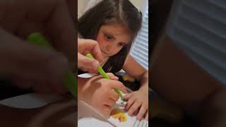 A little trick to help with holding a writing utensil correctly