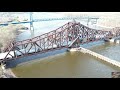 Union pacific swing bridge caught closing and two mixed freights cross bridge with drone views