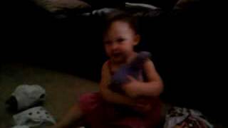 Ava playing with her diapers.