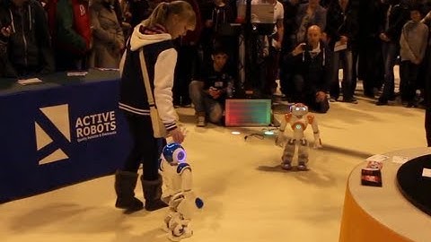 Girl walking Hand in Hand with NAO - The Humanoid Robot -- The Gadget Show Live 2013