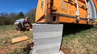 Using hydraulic jacks to lift shipping container workshop