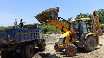 JCB Backhoe Loading River Gravel in Dump Truck