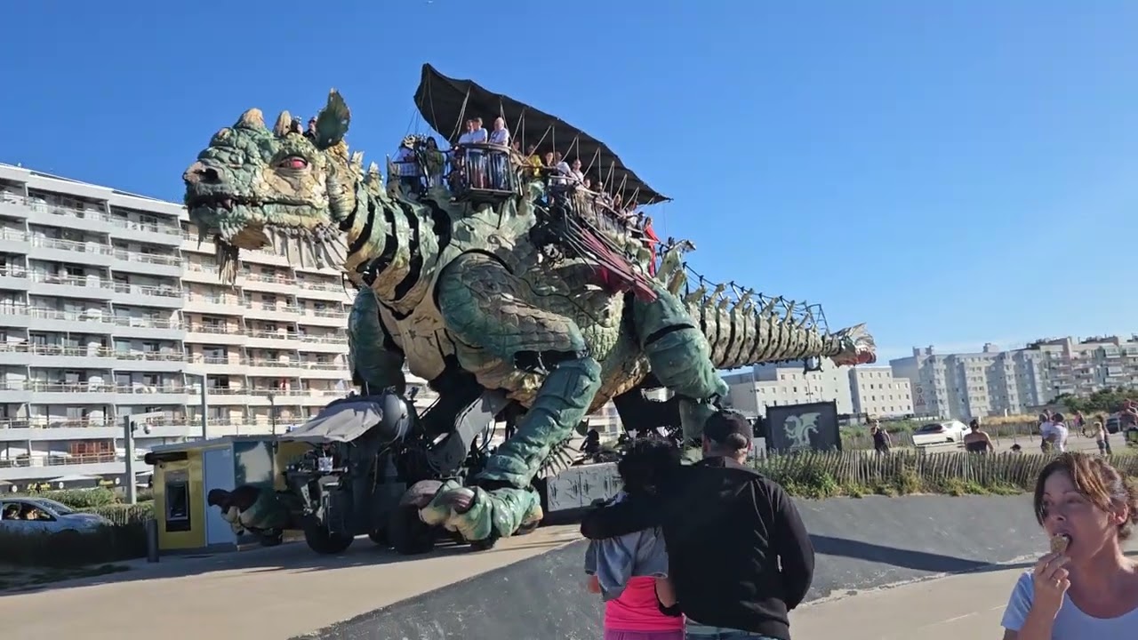 Calais mechanical dragon walking the street attacking cars
