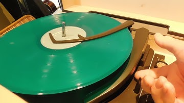 Zenith STEREO record player playing a couple LP records.