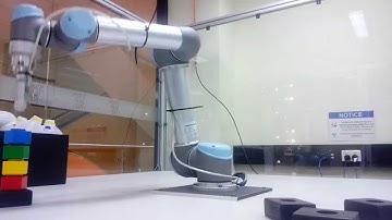 Robot arm stacking Lego Duplo bricks