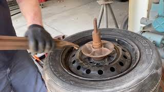 Using the old tire changer to removing a tire