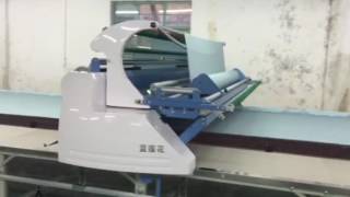 Woven fabric spreading machine---double pulling