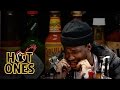 Curren$y Talks Munchies, Industry Games, and Rap Dogs While Eating Spicy Wings | Hot Ones