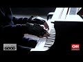 João Carlos Martins: Injured pianist can play again thanks to bionic gloves