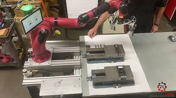 Loading  and unloading clamp demonstration on how a robotic arm can be used in a machine shop