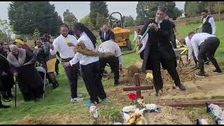 Sis Mansy Funeral graveside clip of musicians and those filling the grave