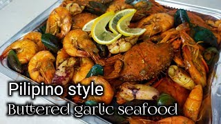 Pilipino style Buttered garlic seafood/ by mhelchoice