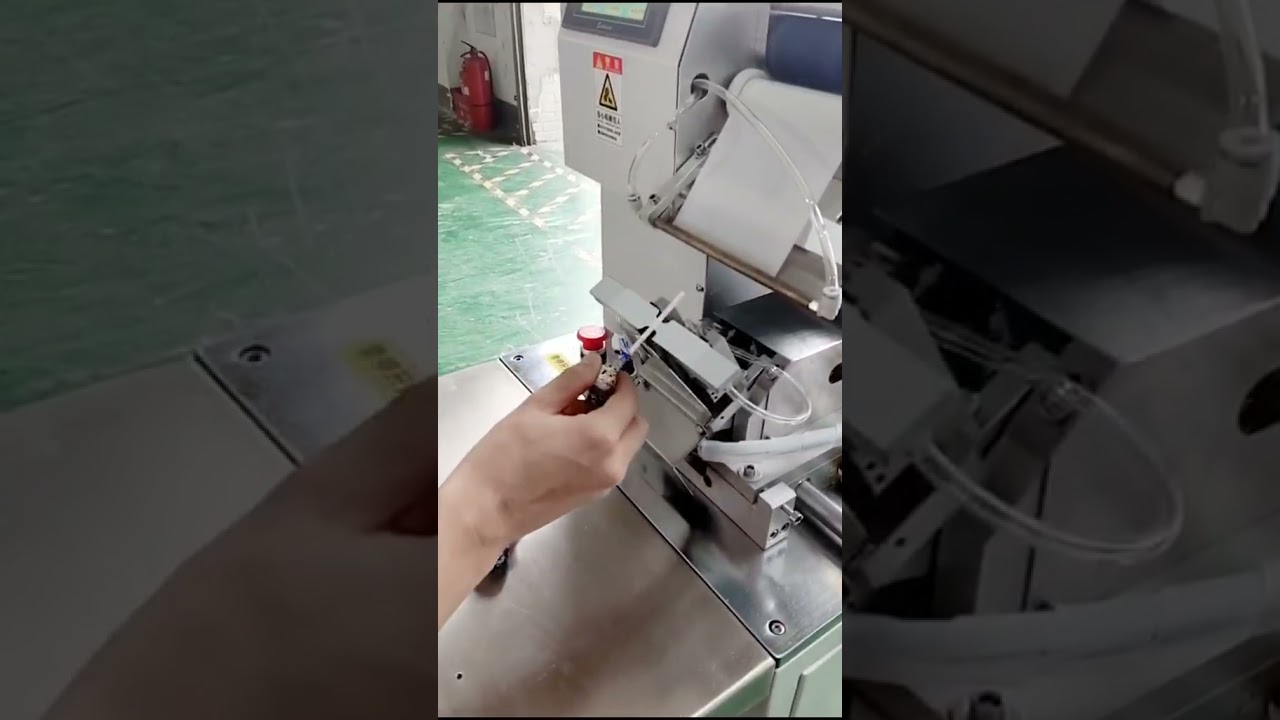 Flag tagging machine for lollipop