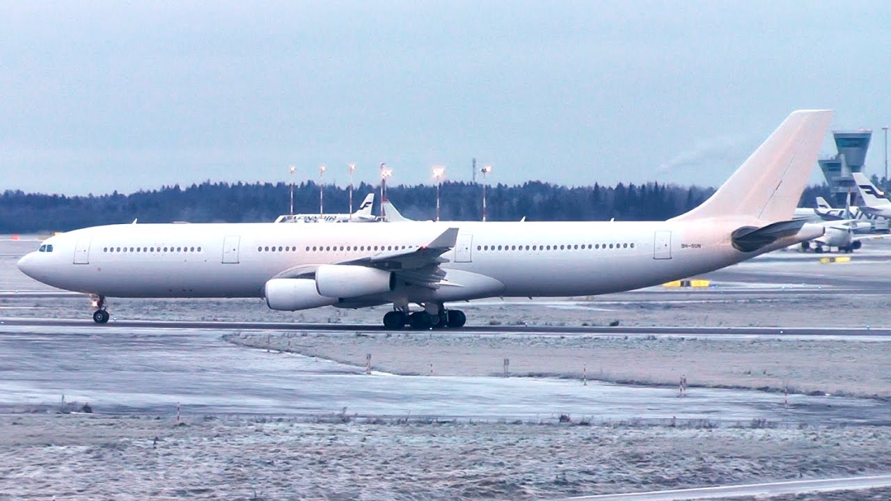 White Airbus A340 - Hi Fly takeoff at Helsinki in cold conditions