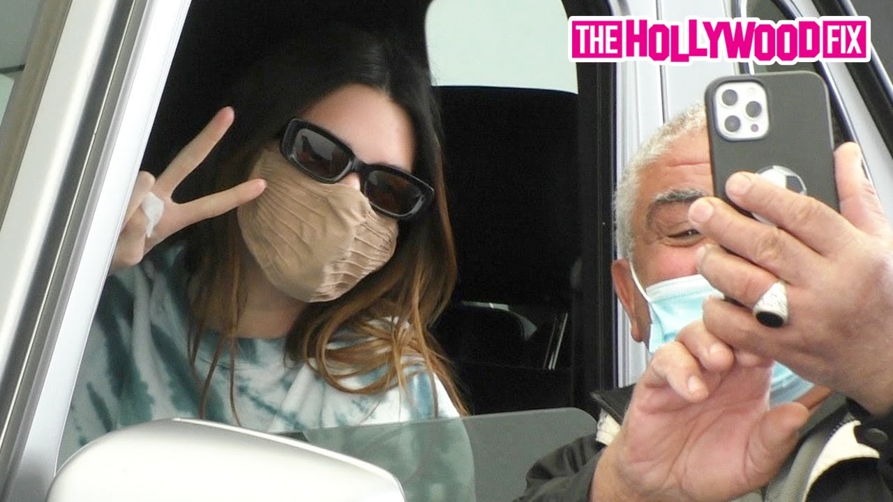 Kendall Jenner Is In The Best Mood & Flashes A Peace Sign While Taking A Selfie With A Fan 2.3.21