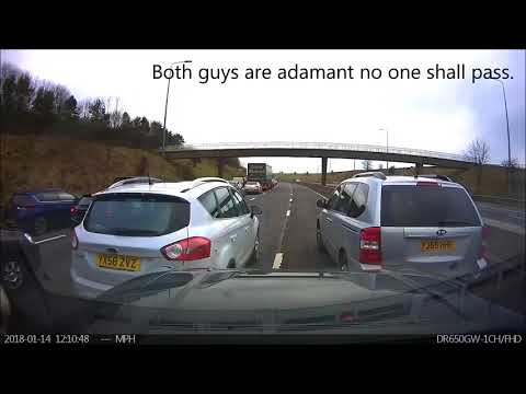 Watch Two Idiot Drivers Block Half A Motorway For No Damn Reason