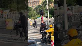 Topless boy wearing traffic cone poses on street in Tianjin, China