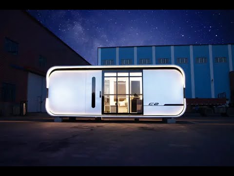 Futuristic prefab home with sleek lines and folding built-in furniture | Cube 2 by Nestron