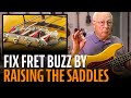 Fixing fret buzz: raising the saddles