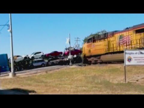 Crazy video of train slamming into semi that got stuck on the tracks ...