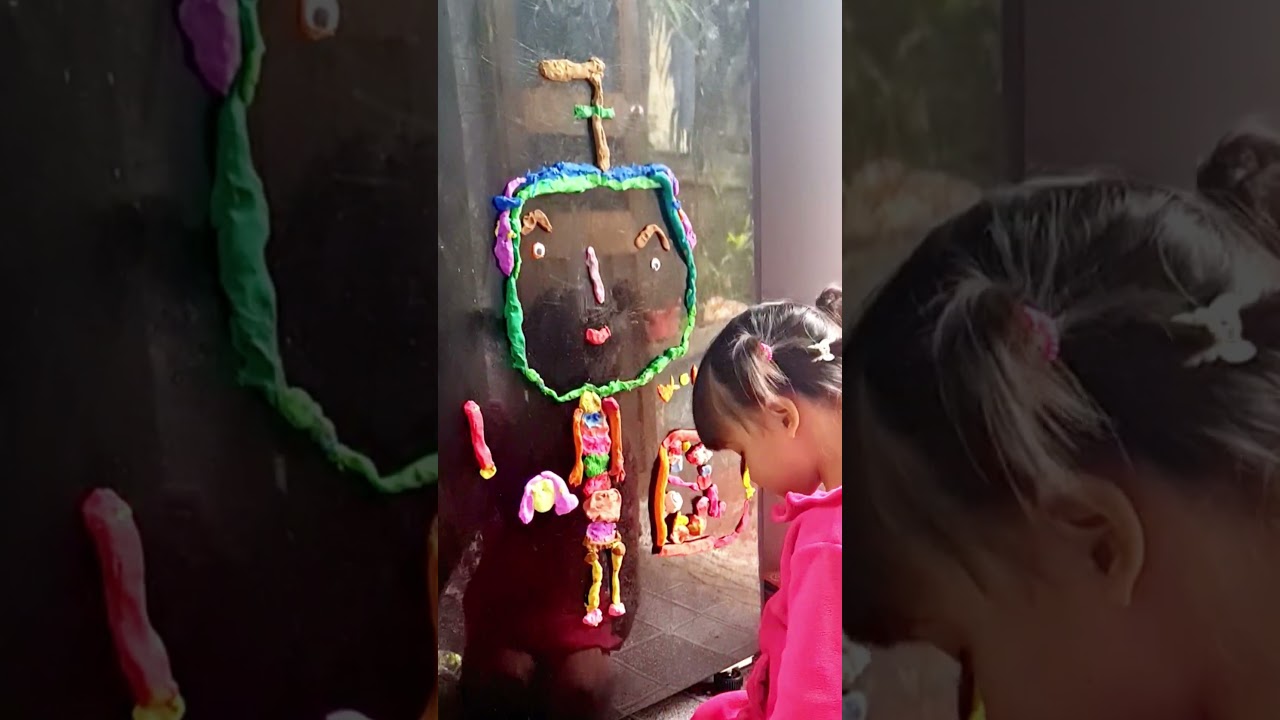 Kid artist's clay art on the fridge