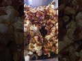 Hot caramel poured over fresh popcorn and peanuts — quick mix, sticky finish.