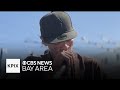 Regular opera singer outside San Francisco's Orpheum Theatre credits singing for saving his life