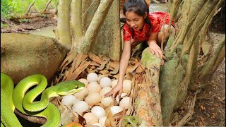 smart woman Cooking snake egg for eating at river - Egg eating delicious 001