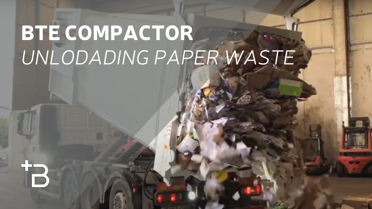 Roll off compactor unloading paper waste - YouTube